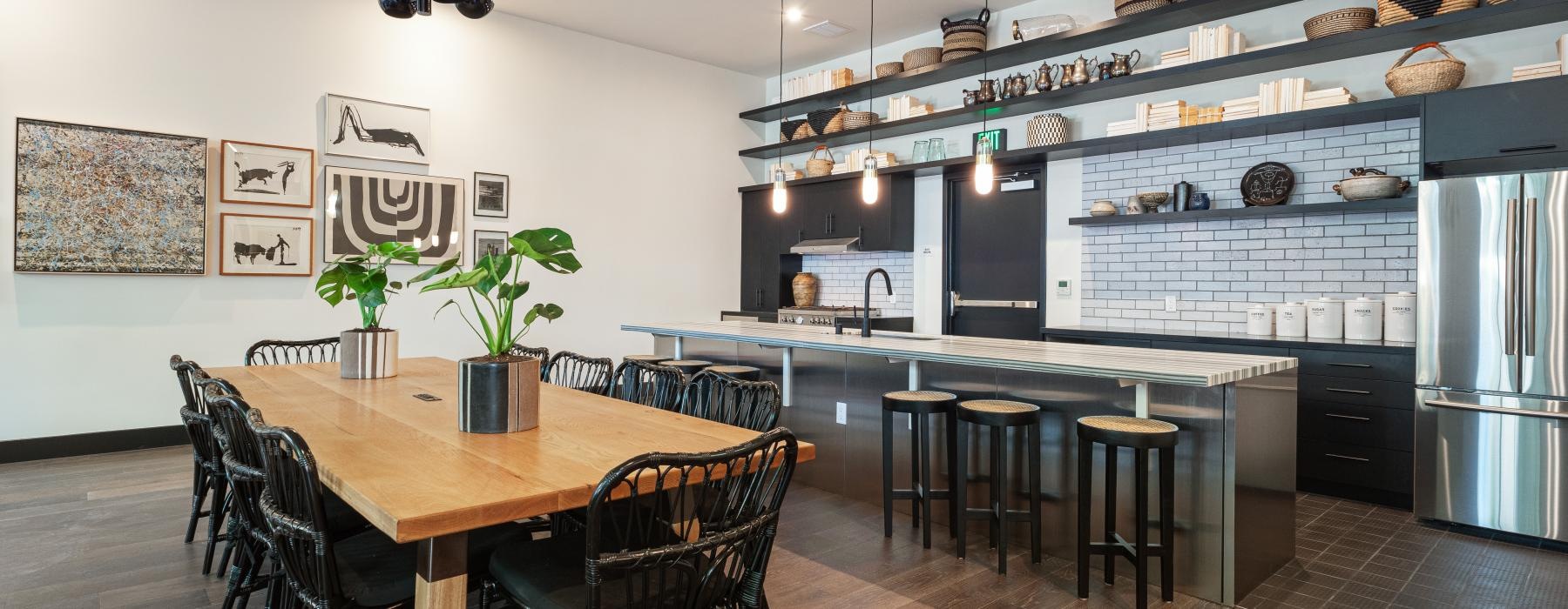 a kitchen with a table and chairs