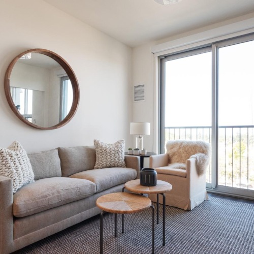 Beautiful living areas to match your lifestyle a living room with a large mirror