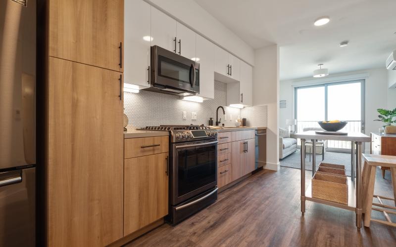 a kitchen with wooden cabinets