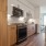 a kitchen with wooden cabinets