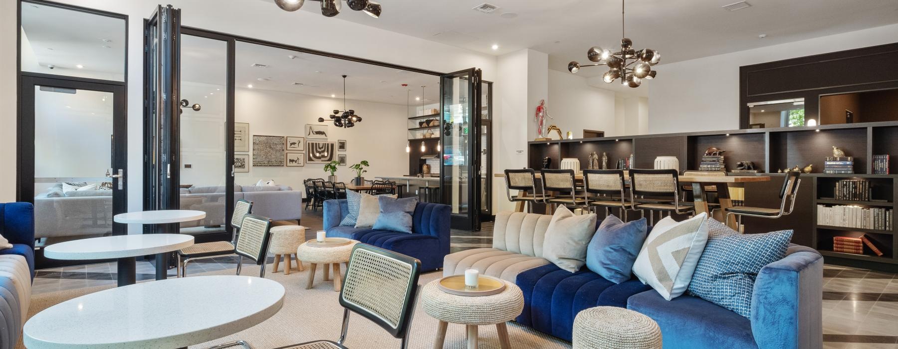 a room with a couch and chairs