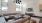 a living room with a chandelier and a couch