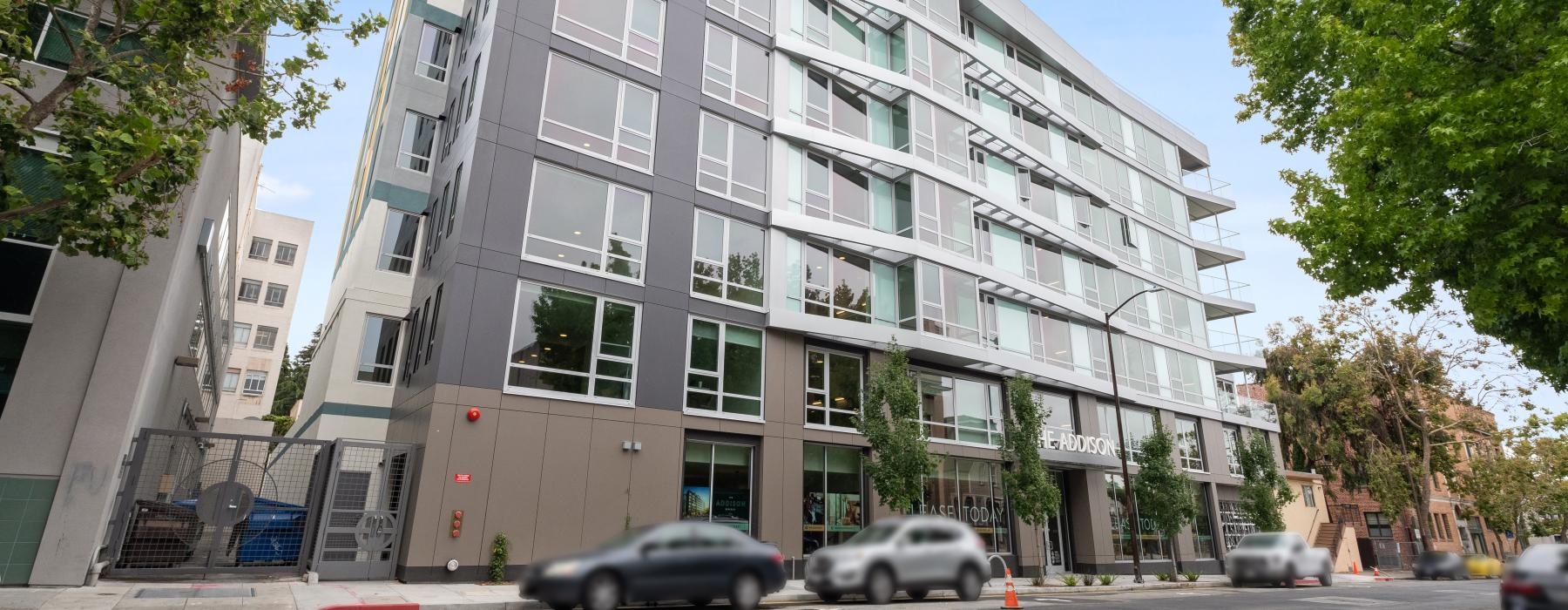 a building with cars parked in front